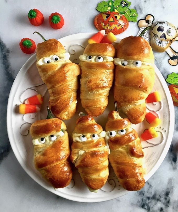 10 Delicious Halloween Recipes For Your Party This Fall easy halloween jalapeno mummies 1 - 10 Delicious Halloween Recipes For Your Party This Fall